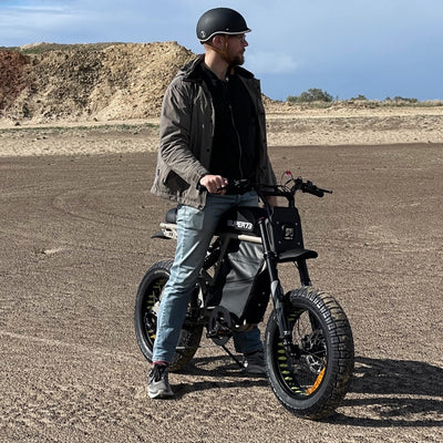 Man on a Super73 eBike with a Thousand Carbon Black helmet