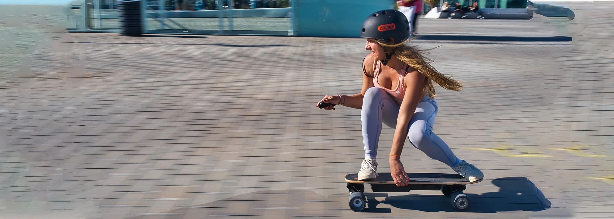 Blonde riding a Meepo Electric Skateboard