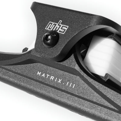 Close-up of MBS Matrix III CNC truck's wide top truck and adjustable shock block positions.