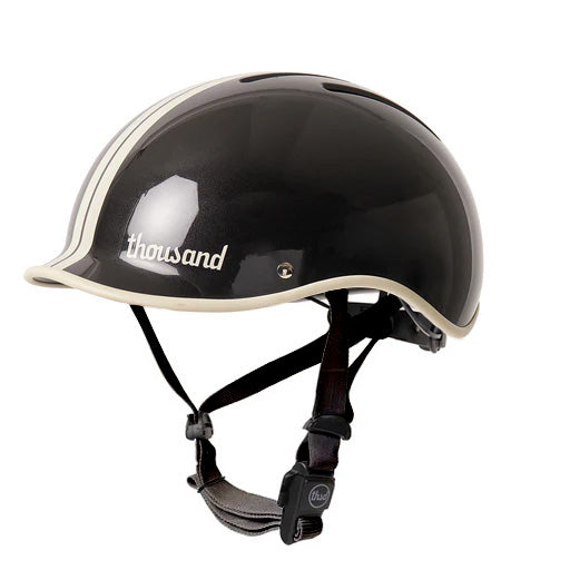 Phantom black thousand helmet with white speed stripe and black nylon strap.