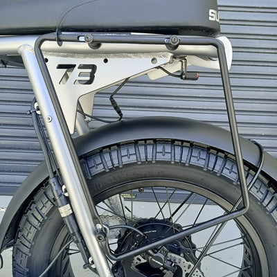 Super73 pannier bag mounting rack on a silver bike