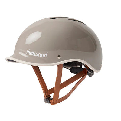 Gray helmet with 'thousand' branding on a white background