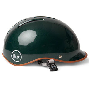 British racing green helmet with white Thousand logo on a white backdrop.
