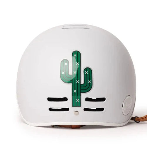 reflective green cactus shaped sticker on a white Thousand helmet