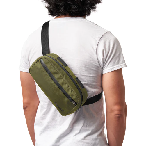 Green shoulder sling bag by thousand.