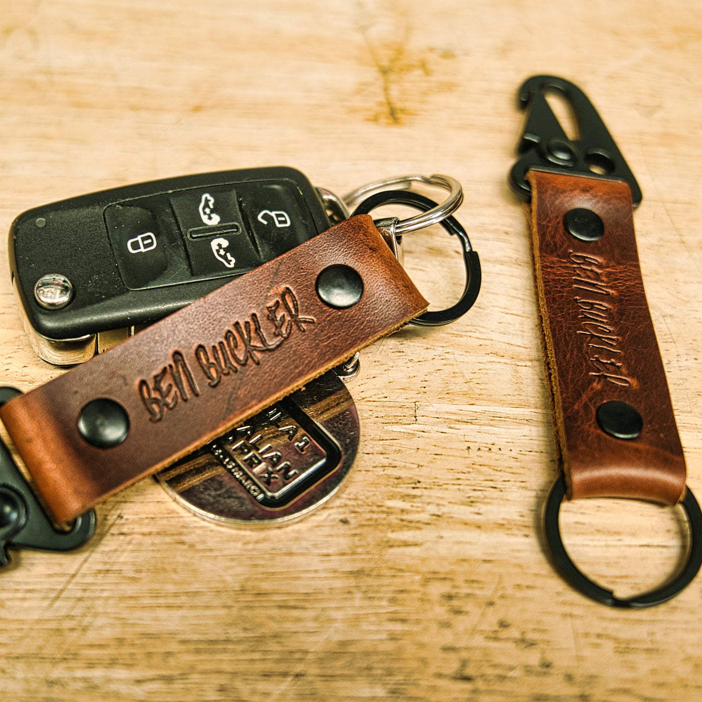 leather key chains displayed on a table